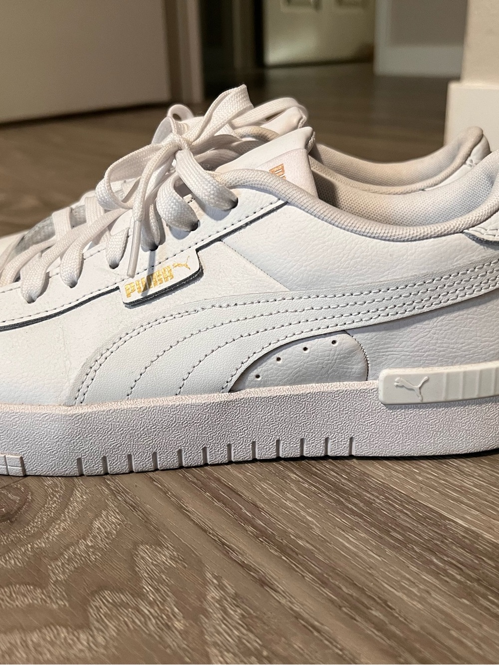 Puma Women's White Low-Top Leather Sneakers with Gold Accent